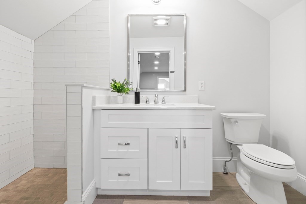 31 Kenilworth Road Arlington, MA 02476 - Photo 34 of 41 a bathroom with a sink vanity mirror and toilet