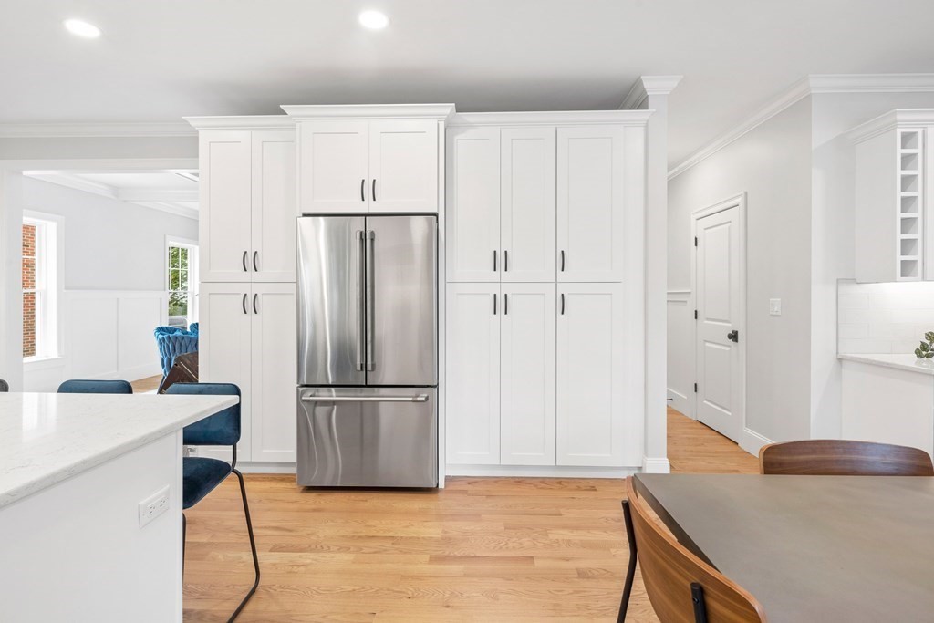 31 Kenilworth Road Arlington, MA 02476 - Photo 5 of 41 a kitchen with stainless steel appliances a refrigerator sink and cabinets