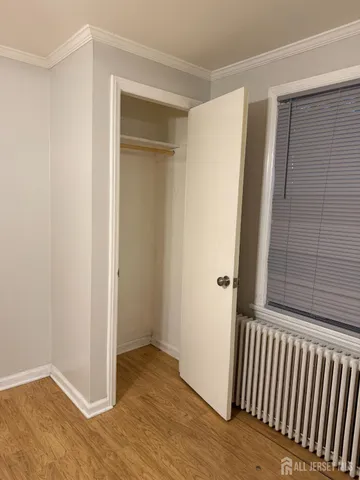 a view of a room with wooden floor and staircase