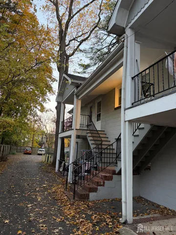 a view of street with large trees