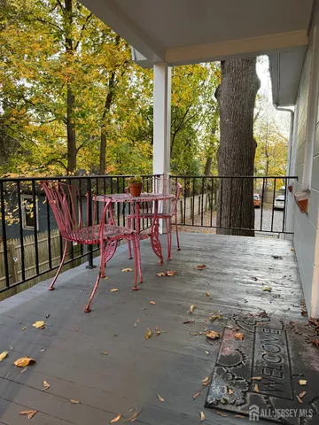a view of a patio with a table chairs