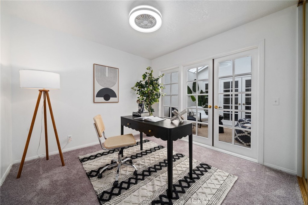 2181 Maple Court Tustin, CA 92780 - Photo 14 of 29 a view of a workspace with furniture and rug