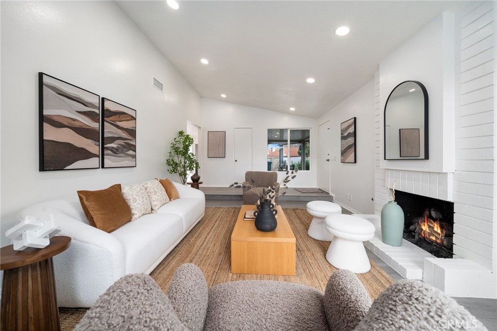 2181 Maple Court Tustin, CA 92780 - Photo 2 of 29 a living room with furniture fireplace and window