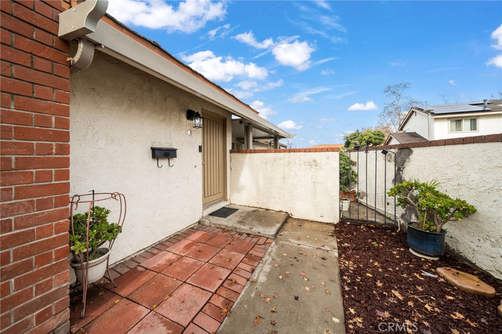 2181 Maple Court Tustin, CA 92780 - Photo 26 of 29 a view of backyard with potted plants