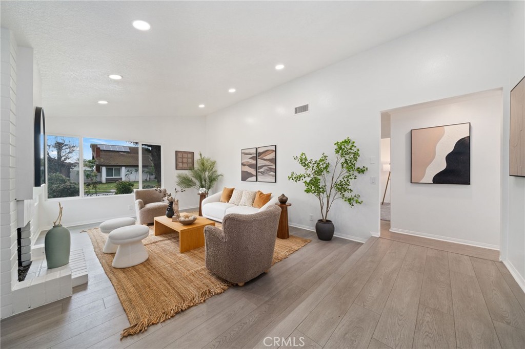 2181 Maple Court Tustin, CA 92780 - Photo 6 of 29 a living room with furniture potted plant and windows
