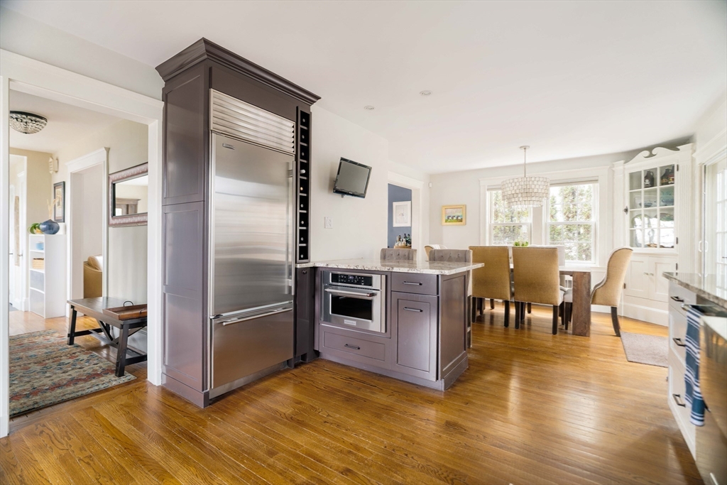 9 Eastern Avenue Arlington, MA 02476 - Photo 13 of 40 a kitchen with stainless steel appliances granite countertop a refrigerator and a stove top oven