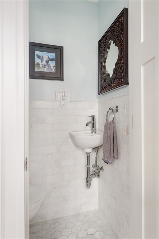 9 Eastern Avenue Arlington, MA 02476 - Photo 18 of 40 a bathroom with a sink and mirror