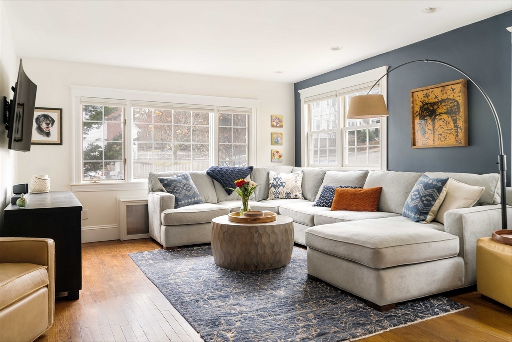 9 Eastern Avenue Arlington, MA 02476 - Photo 2 of 40 a living room with furniture and a large window