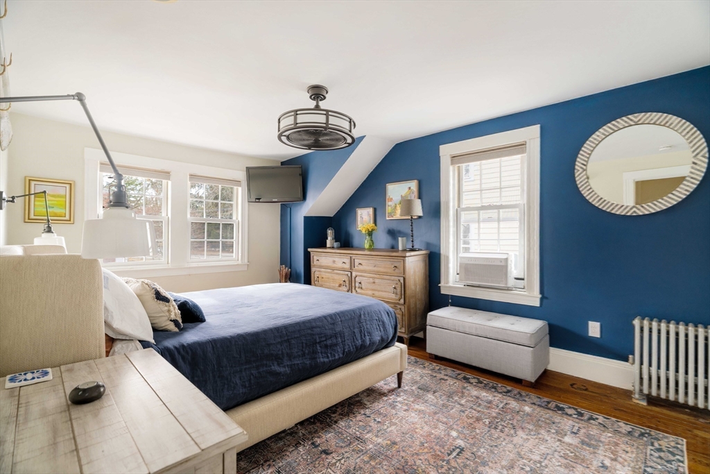 9 Eastern Avenue Arlington, MA 02476 - Photo 22 of 40 a bedroom with a bed couch and window