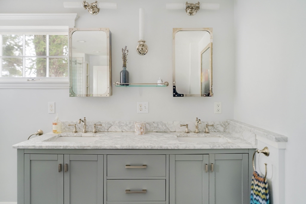 9 Eastern Avenue Arlington, MA 02476 - Photo 28 of 40 a bathroom with a sink vanity and mirror