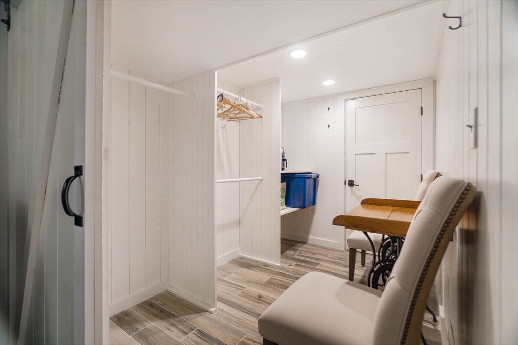 9 Eastern Avenue Arlington, MA 02476 - Photo 34 of 40 a view of a hallway with furniture and wooden floor