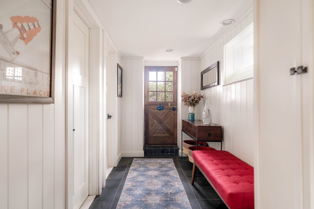 9 Eastern Avenue Arlington, MA 02476 - Photo 35 of 40 a hallway with a couch