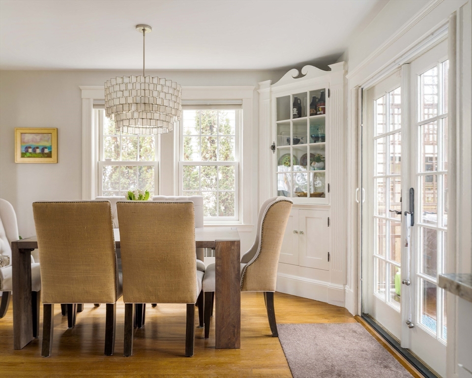 9 Eastern Avenue Arlington, MA 02476 - Photo 7 of 40 a view of a dining room with furniture wooden floor and a chandelier