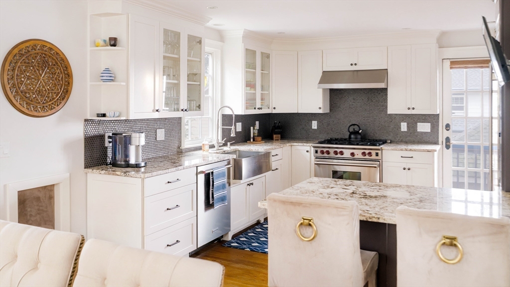 9 Eastern Avenue Arlington, MA 02476 - Photo 8 of 40 a kitchen with a sink a stove and cabinets
