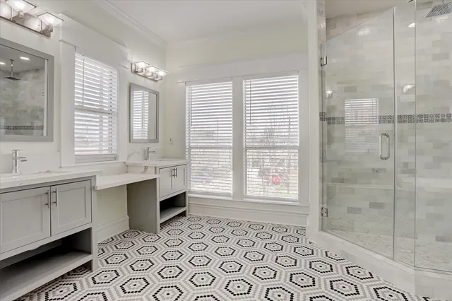 a bathroom with a sink mirror and a bathtub