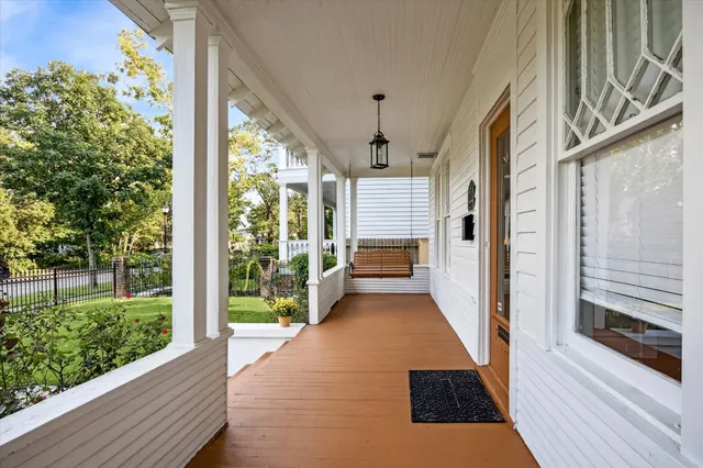 a view of a porch with wooden floor and outdoor space