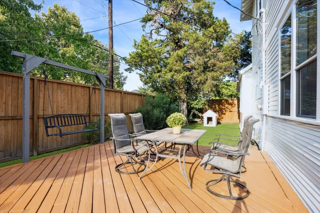 a view of balcony with furniture and wooden floor