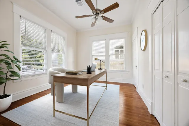 a view of a livingroom with furniture window and wooden floor