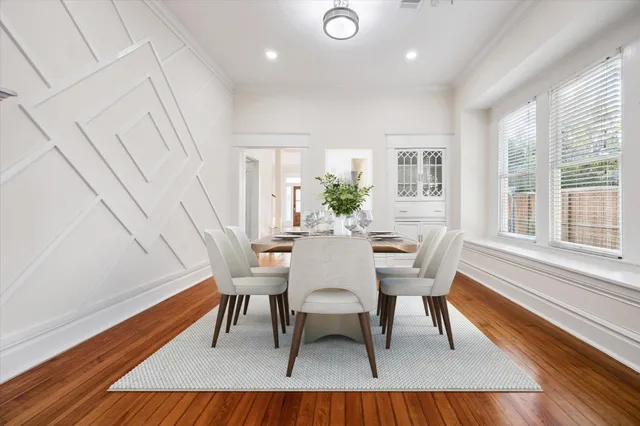 a view of a dining room with furniture and wooden floor