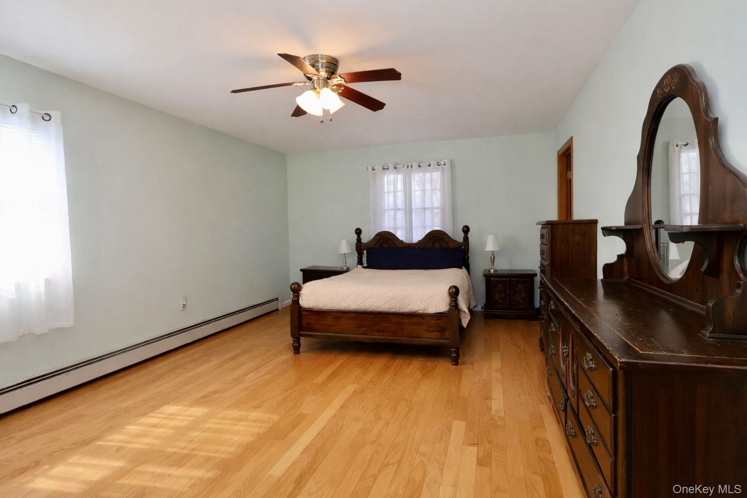 20 Day Road Campbell Hall, NY 10916 - Photo 24 of 41 a bedroom with a bed and ceiling fan