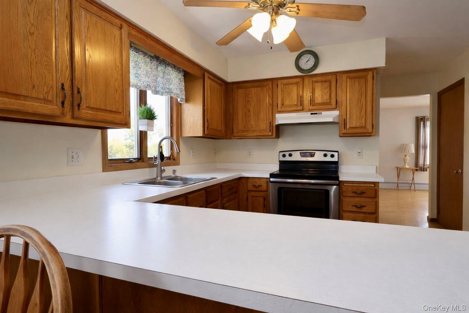 20 Day Road Campbell Hall, NY 10916 - Photo 6 of 41 a kitchen with stainless steel appliances granite countertop a sink a stove and a refrigerator