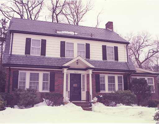 61 Morse Road Newton, MA 02460 - Photo 1 of 1 a front view of a house with yard and trees in the background
