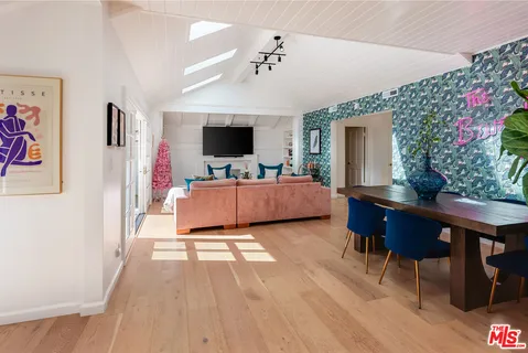 a view of a hallway with living room and with furniture