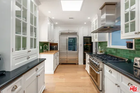 a bedroom with furniture and a flat screen tv