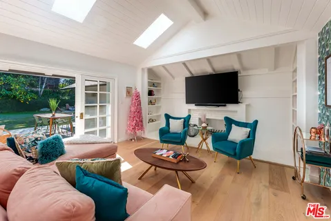 a room with furniture and wooden floor