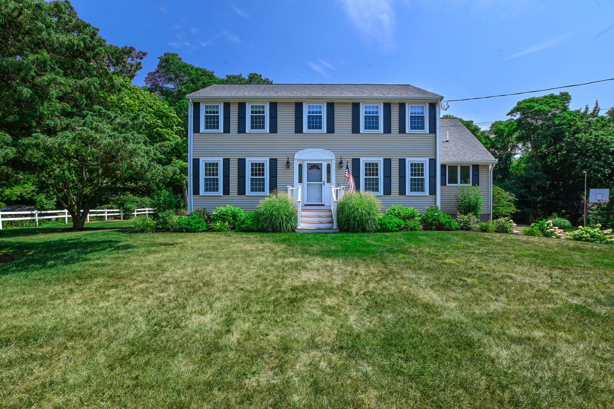 15 Marvin Circle Falmouth, MA 02540 - Photo 1 of 47 a front view of a house with a yard