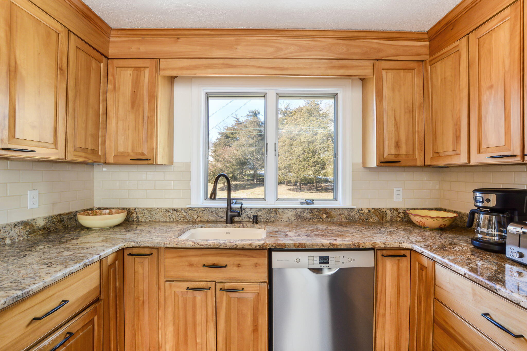 15 Marvin Circle Falmouth, MA 02540 - Photo 20 of 47 a kitchen with sink cabinets and window