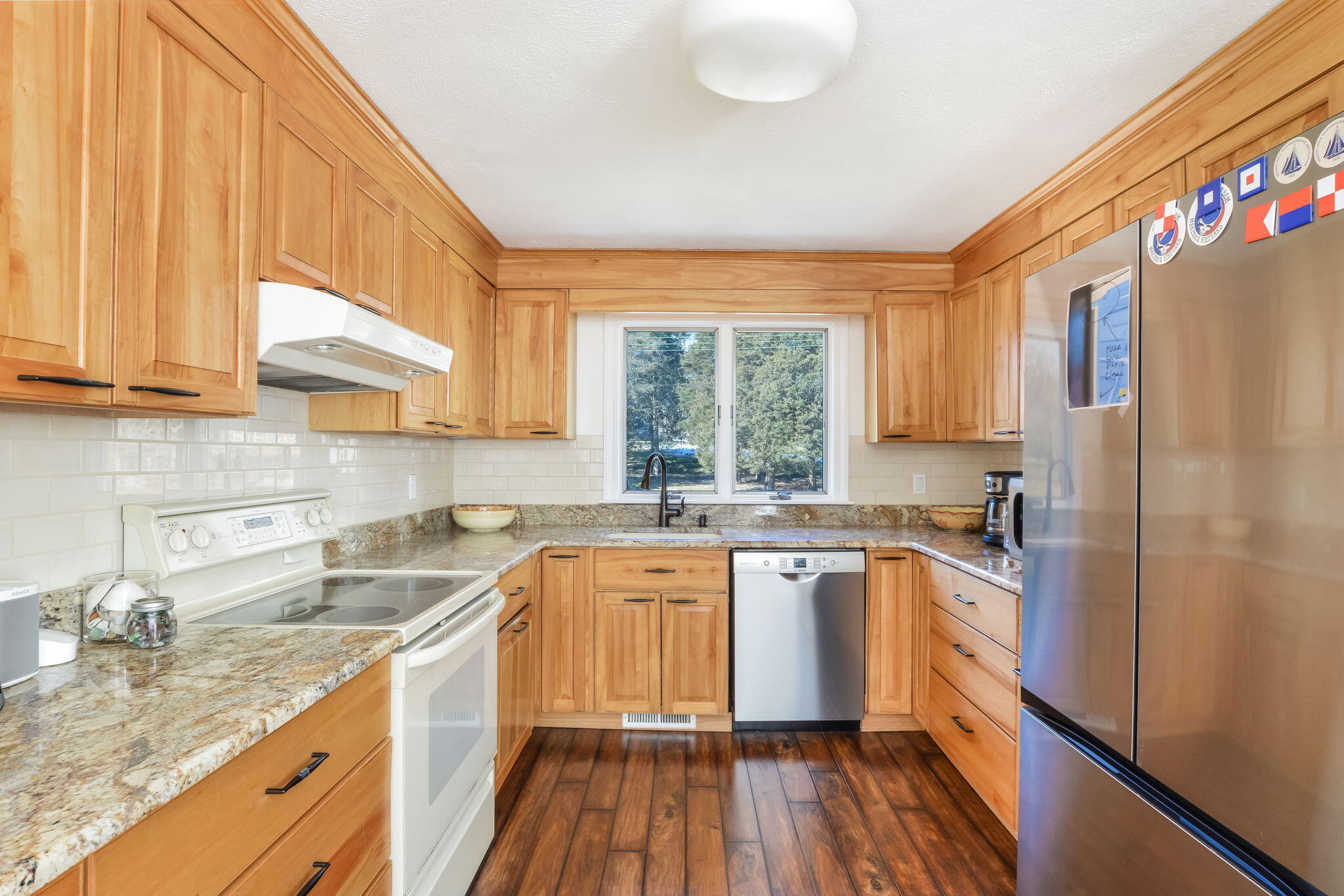 15 Marvin Circle Falmouth, MA 02540 - Photo 21 of 47 a kitchen with a sink a window cabinets stainless steel appliances and a window