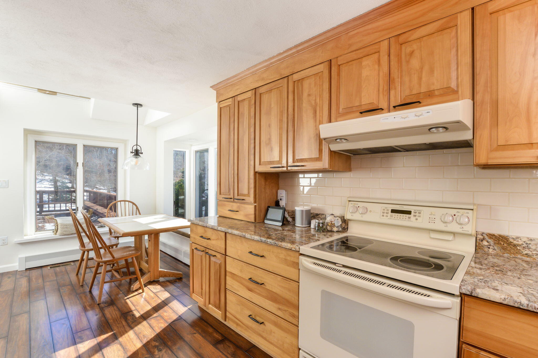 15 Marvin Circle Falmouth, MA 02540 - Photo 22 of 47 a kitchen with stainless steel appliances granite countertop a stove a sink dishwasher and cabinets with wooden floor