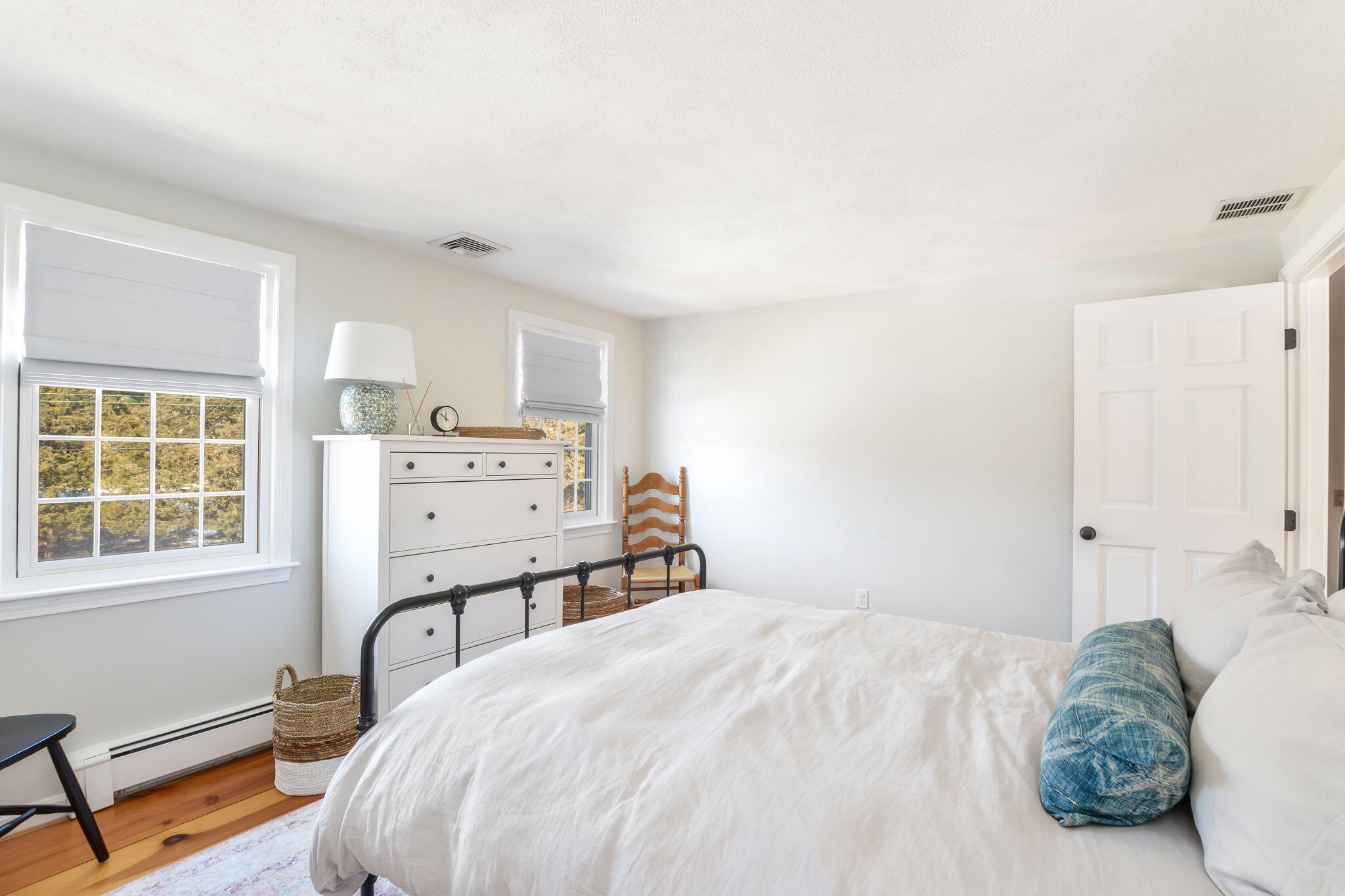 15 Marvin Circle Falmouth, MA 02540 - Photo 27 of 47 a bedroom with a bed and wooden floor