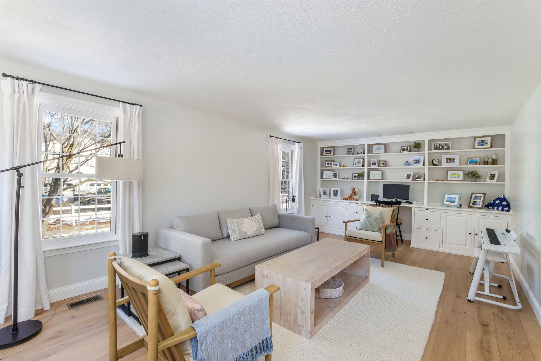 15 Marvin Circle Falmouth, MA 02540 - Photo 9 of 47 a living room with furniture a large window and a wooden floor