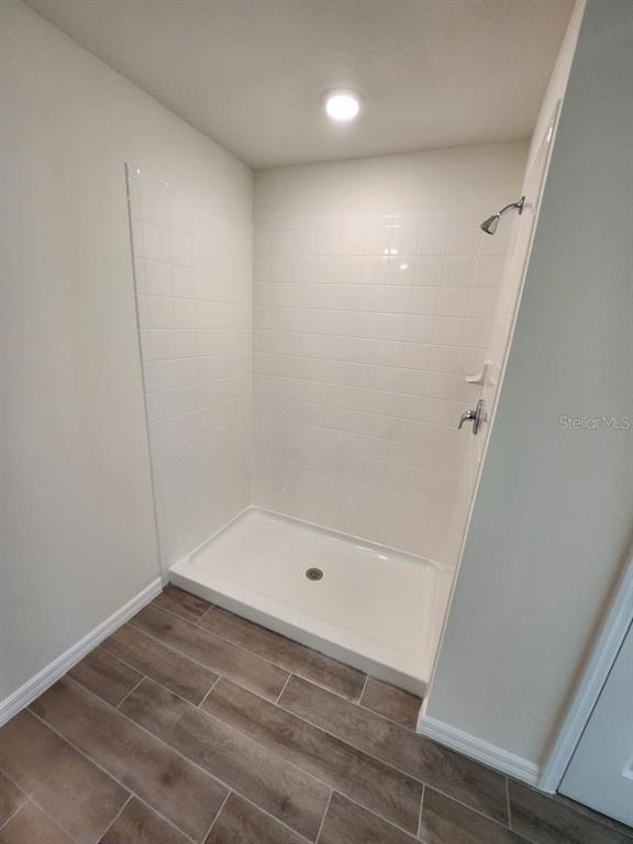 5149 Southwest 48th Lane Gainesville, FL 32608 - Photo 12 of 16 a bathroom with a bathtub