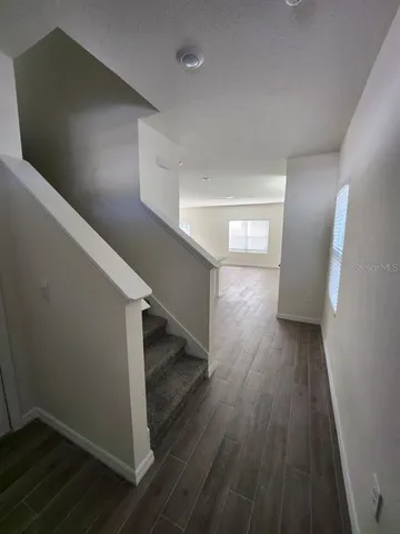 a view of entryway with wooden floor