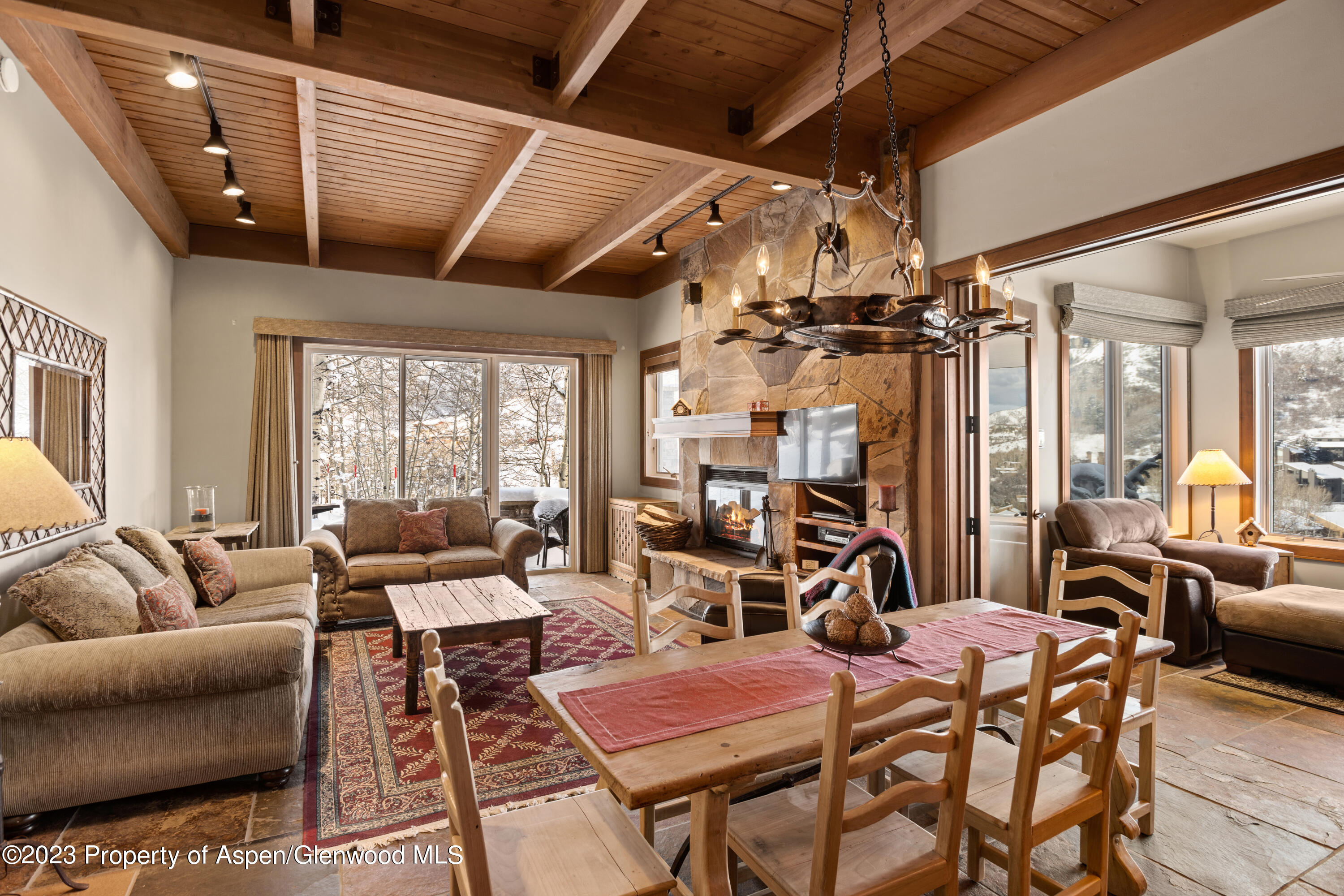 800 Ridge Road, Unit 13 Snowmass Village, CO 81615 - Photo 4 of 23 a outdoor space with lots of tables and chairs