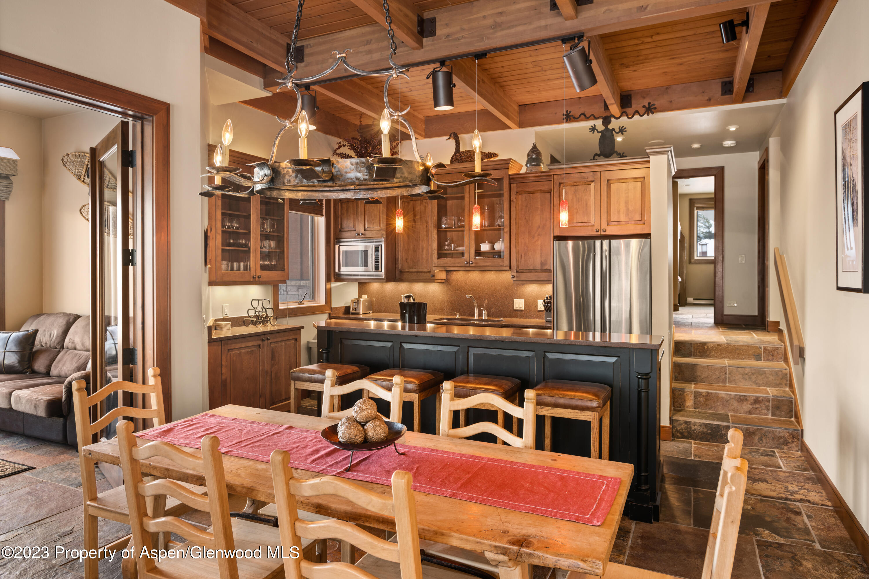 800 Ridge Road, Unit 13 Snowmass Village, CO 81615 - Photo 5 of 23 a view of a dining room with furniture