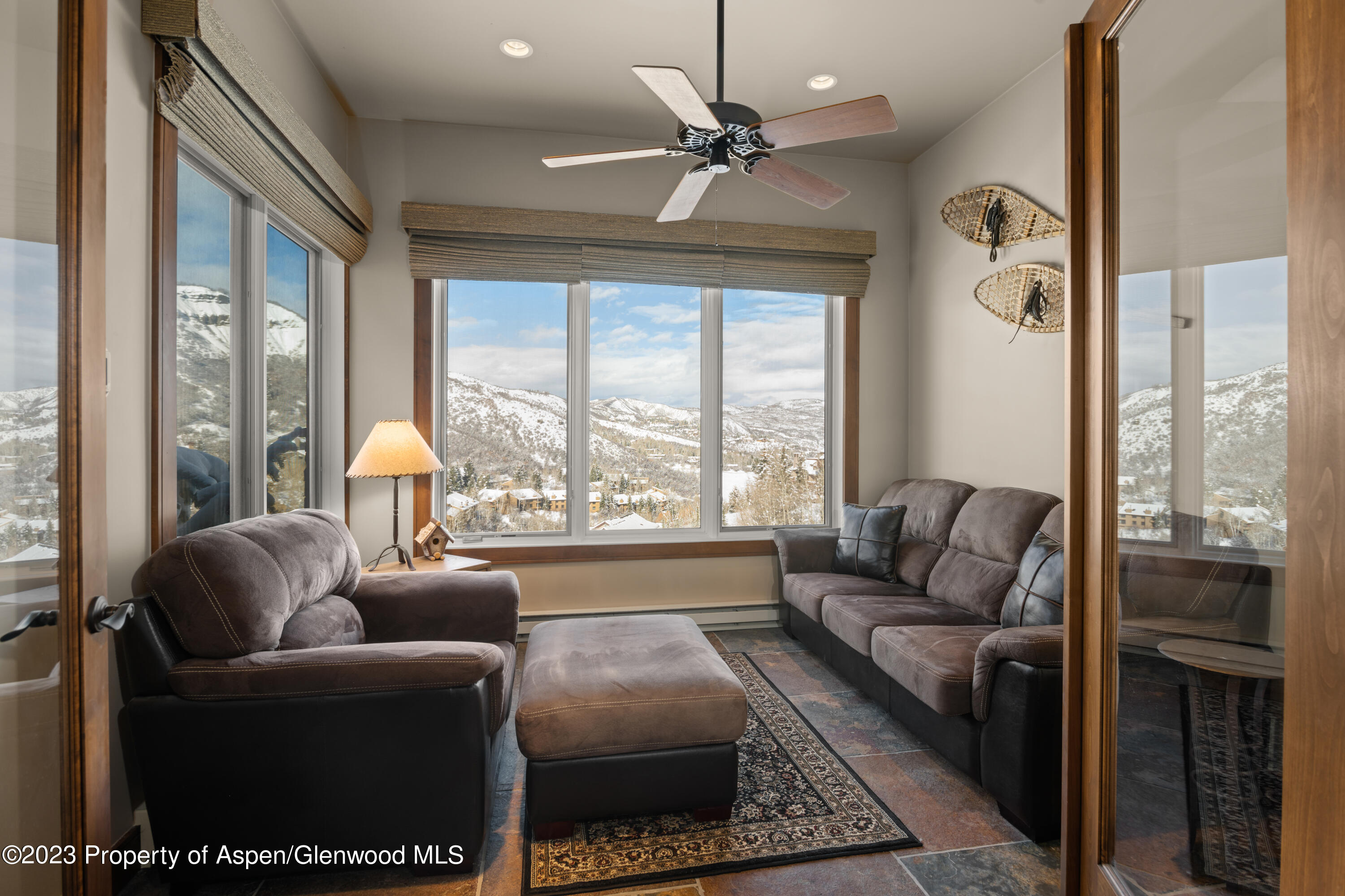 800 Ridge Road, Unit 13 Snowmass Village, CO 81615 - Photo 6 of 23 a living room with furniture and a large window