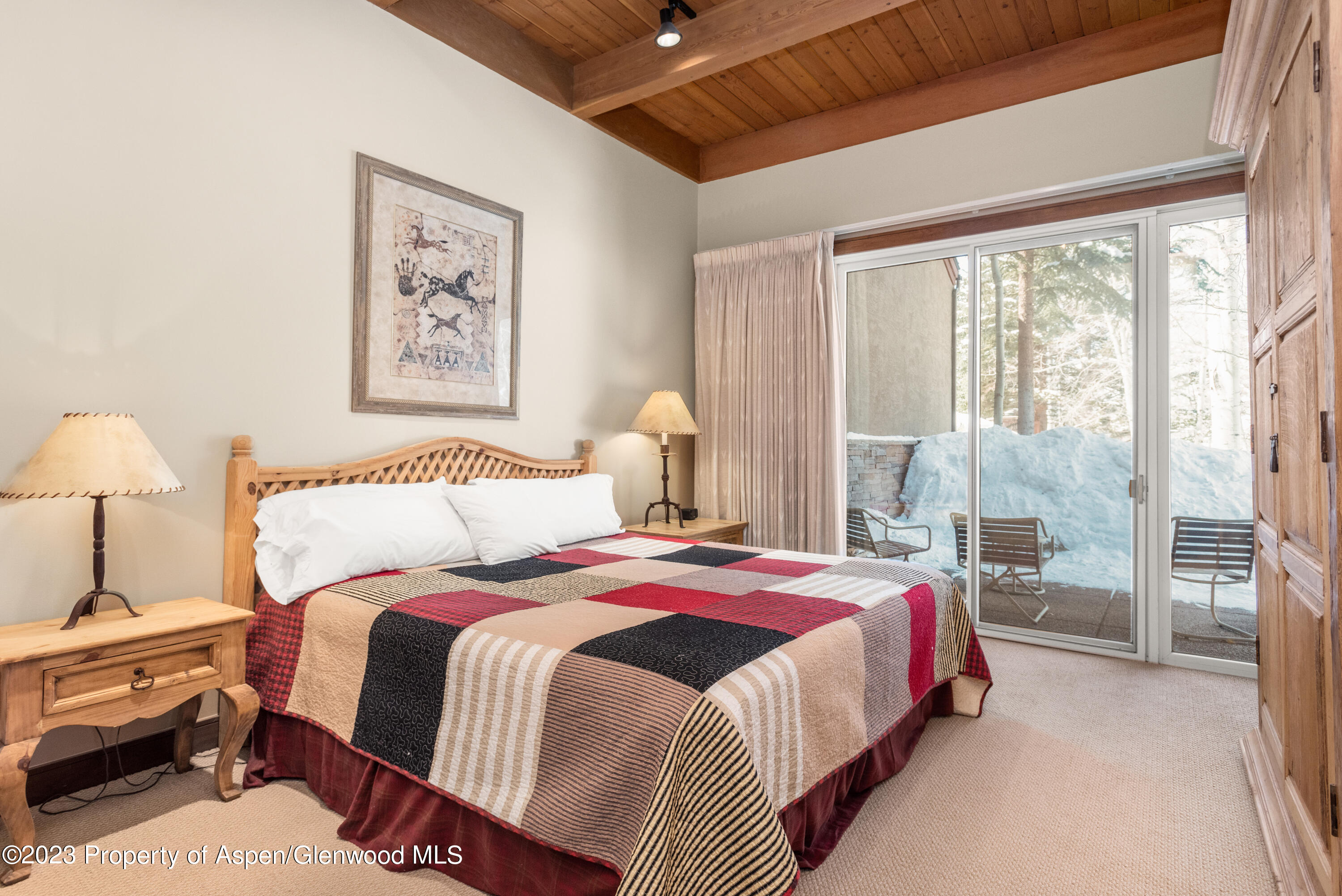 800 Ridge Road, Unit 13 Snowmass Village, CO 81615 - Photo 7 of 23 a bedroom with bed and a window