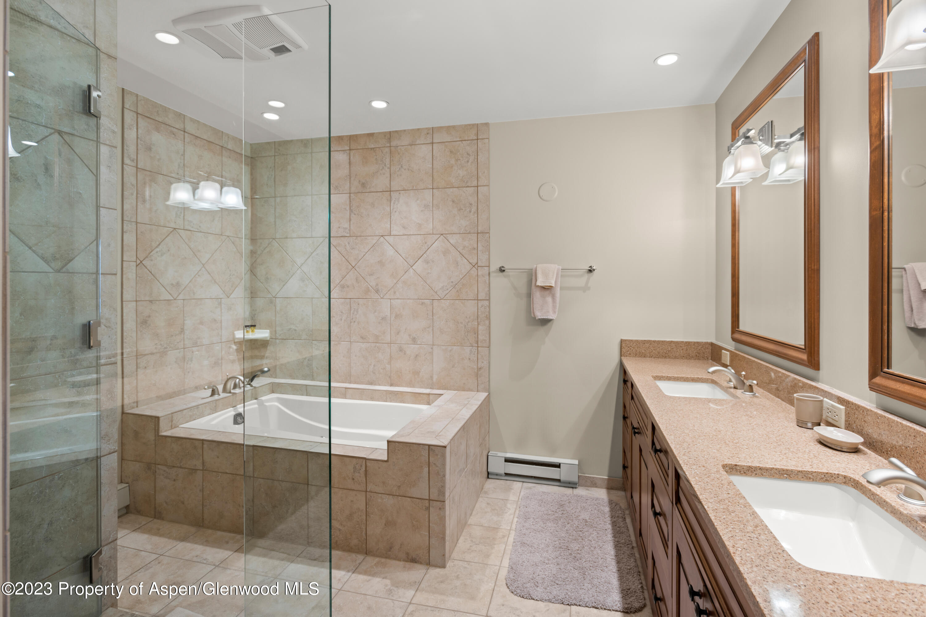 800 Ridge Road, Unit 13 Snowmass Village, CO 81615 - Photo 8 of 23 a bathroom with a tub sink and mirror