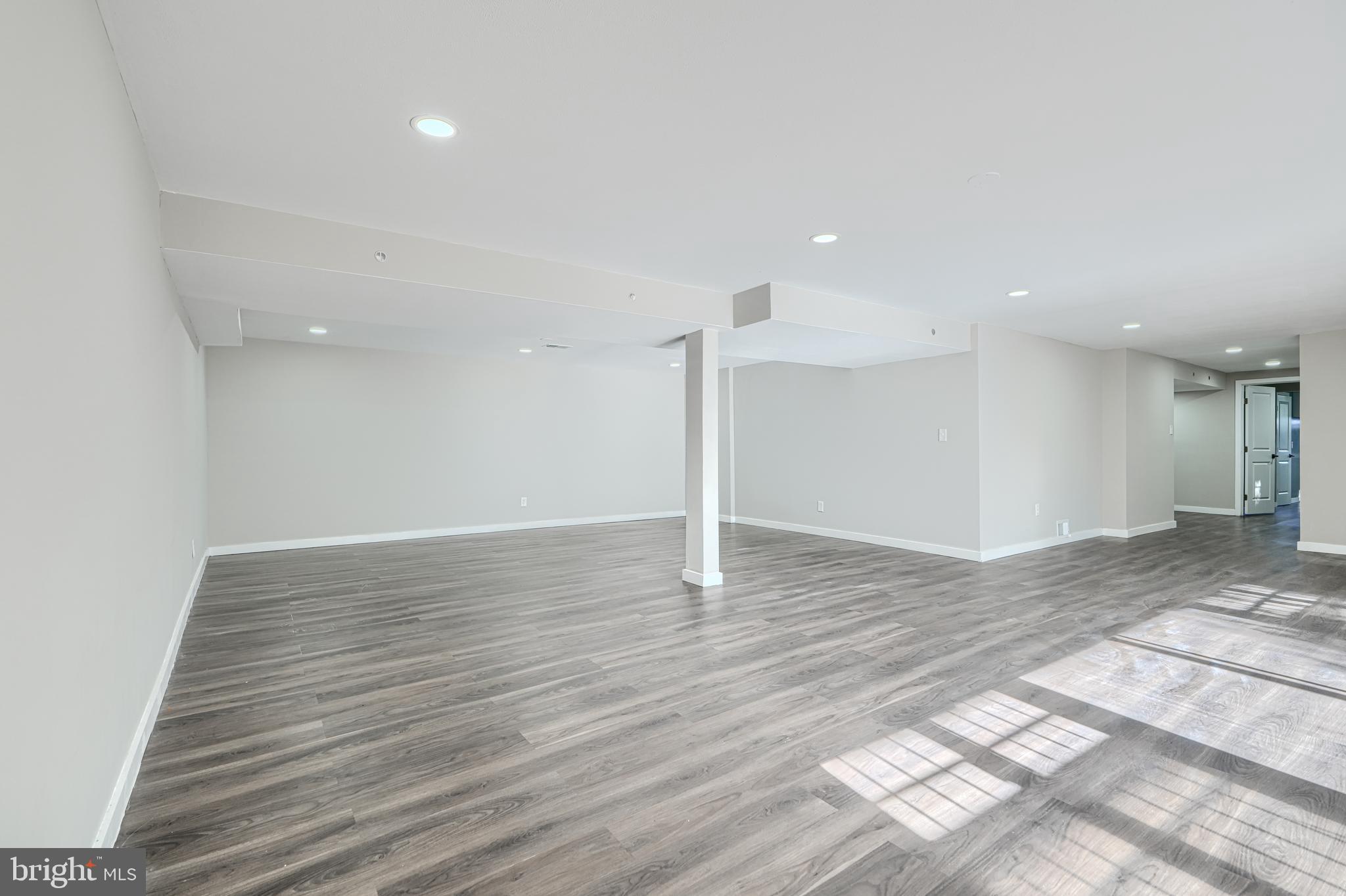 6200 Ivymount Road Baltimore, MD 21209 - Photo 48 of 71 a view of a room with wooden floor and window
