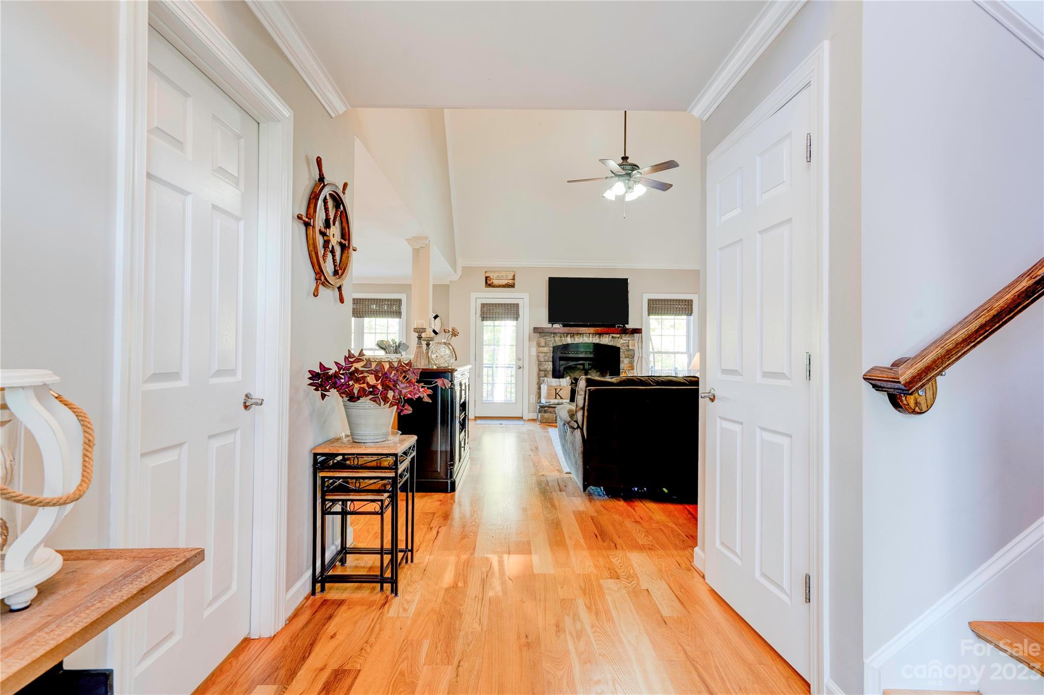 154 Harbor Point Drive Cherryville, NC 28021 - Photo 15 of 40 a view of a livingroom with furniture a flat screen tv and staircase