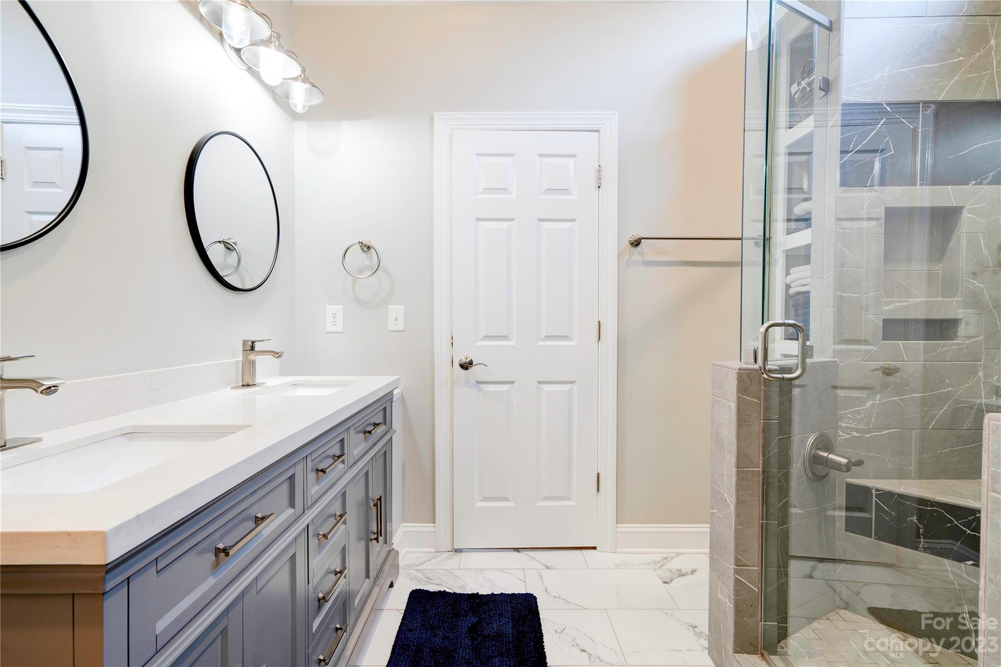 154 Harbor Point Drive Cherryville, NC 28021 - Photo 18 of 40 a spacious bathroom with a granite countertop sink and a mirror