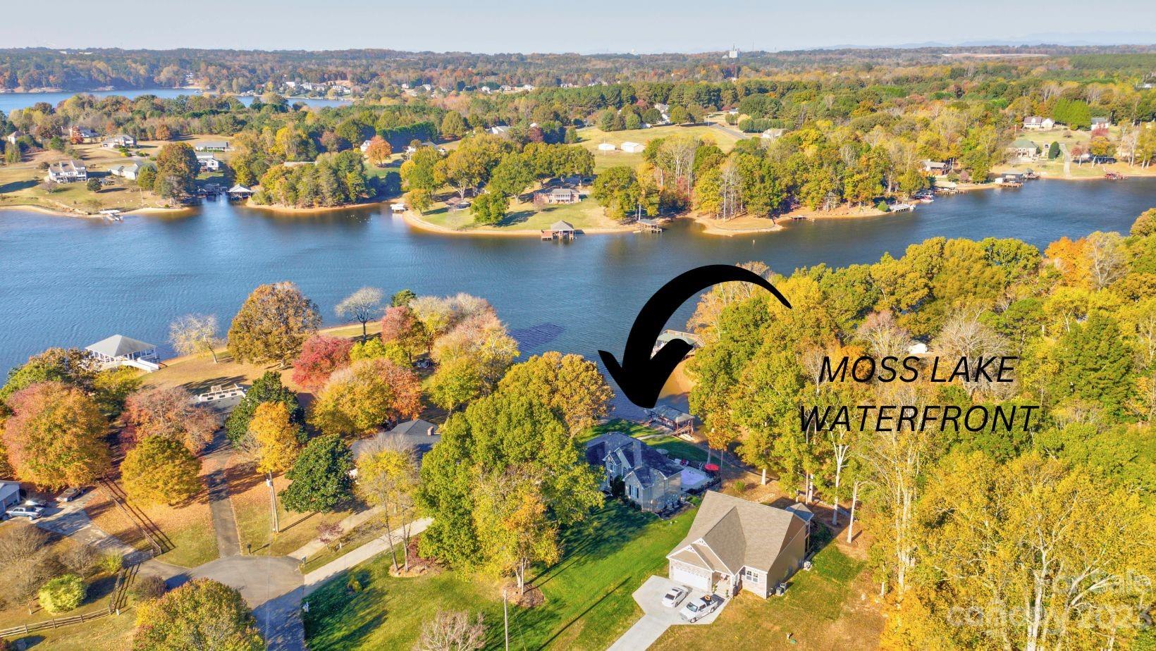 154 Harbor Point Drive Cherryville, NC 28021 - Photo 2 of 40 a picture of a lake with houses