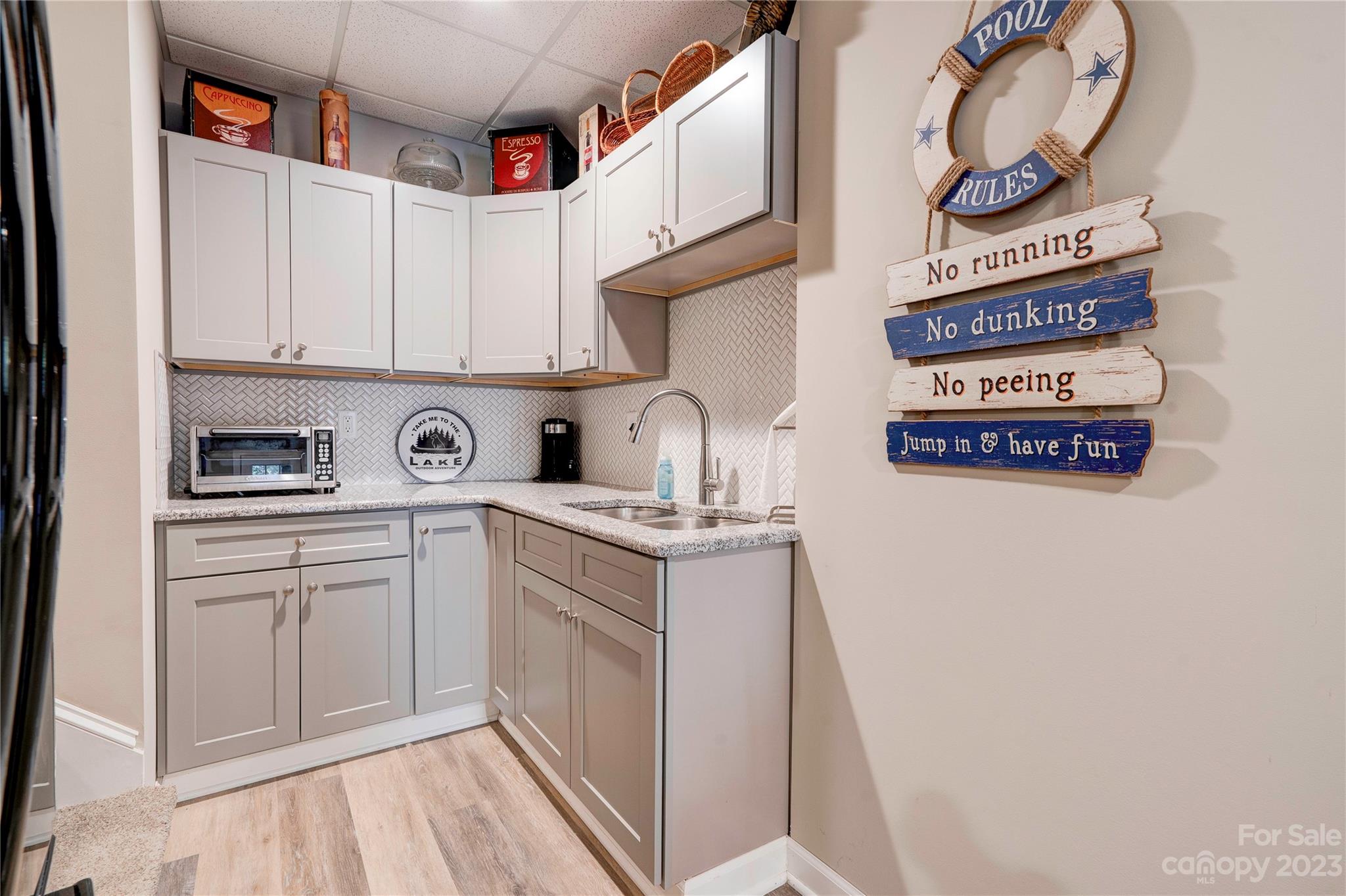 154 Harbor Point Drive Cherryville, NC 28021 - Photo 25 of 40 a kitchen with cabinets and wooden floor