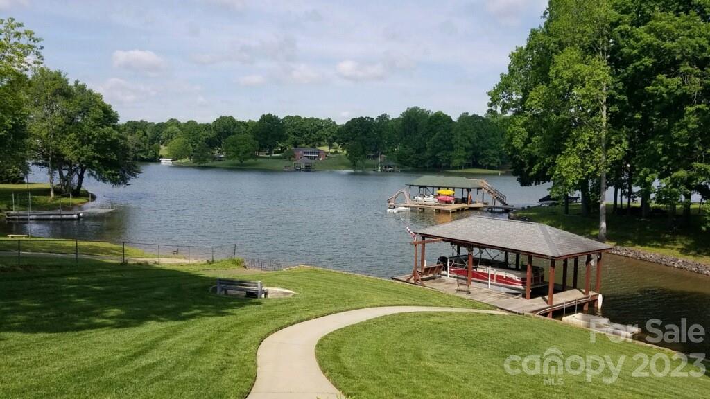 154 Harbor Point Drive Cherryville, NC 28021 - Photo 4 of 40 a aerial view of a house with swimming pool and lake view