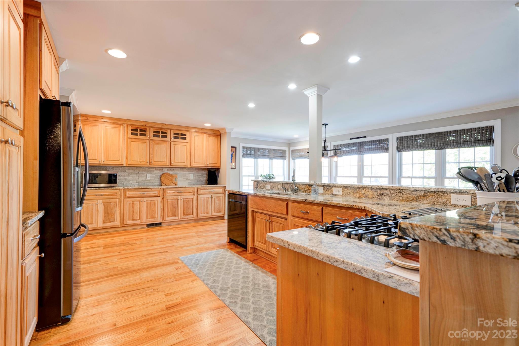 154 Harbor Point Drive Cherryville, NC 28021 - Photo 7 of 40 a kitchen with stainless steel appliances granite countertop a stove and a refrigerator
