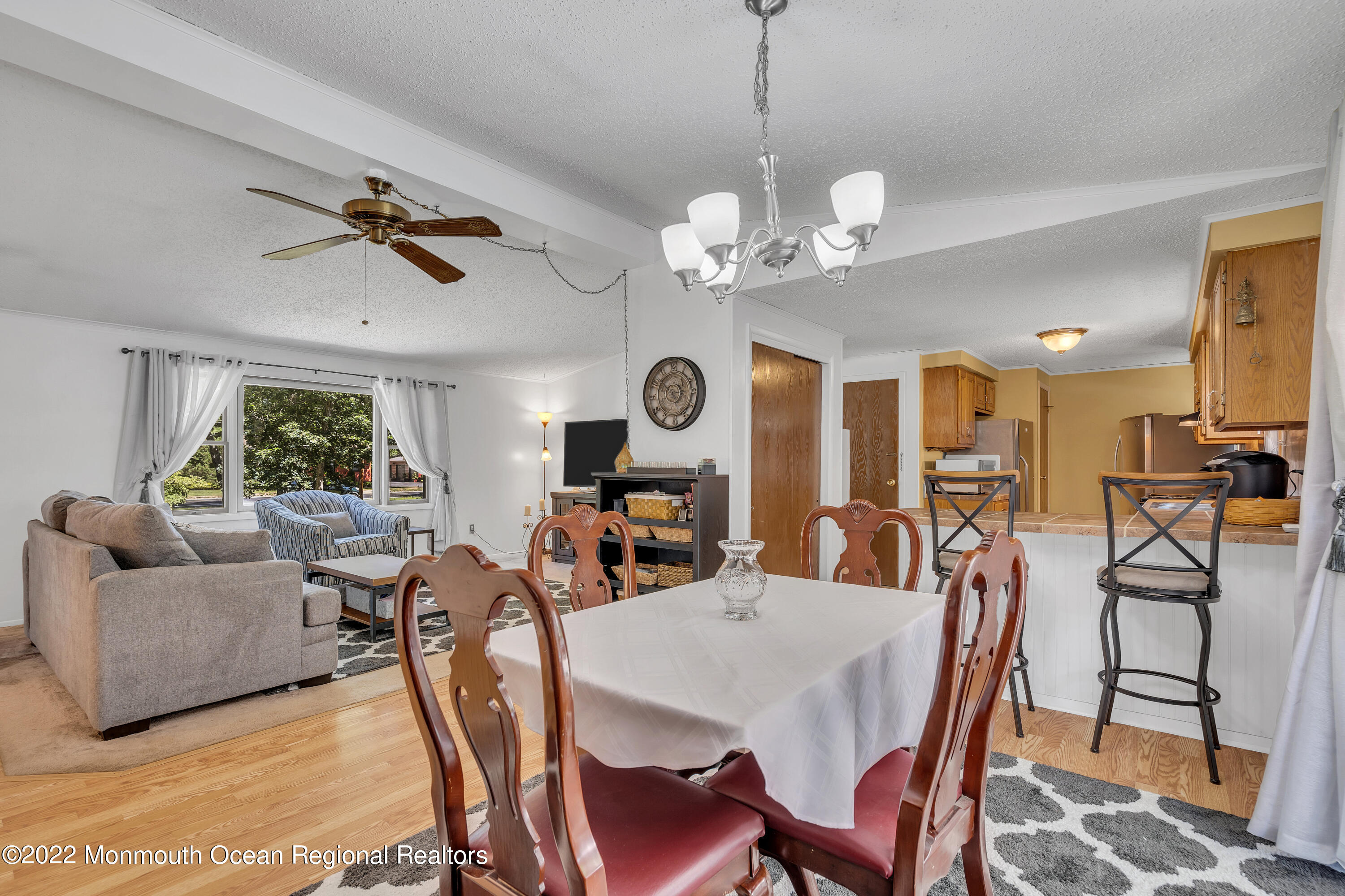 356 Cedar Swamp Road Jackson, NJ 08527 - Photo 13 of 56 a view of a dining room with furniture a rug and wooden floor